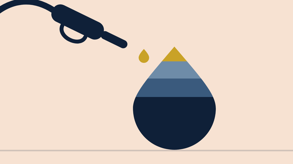A fuel nozzle above a large droplet divided into four bands, the bottom band about half the droplet.